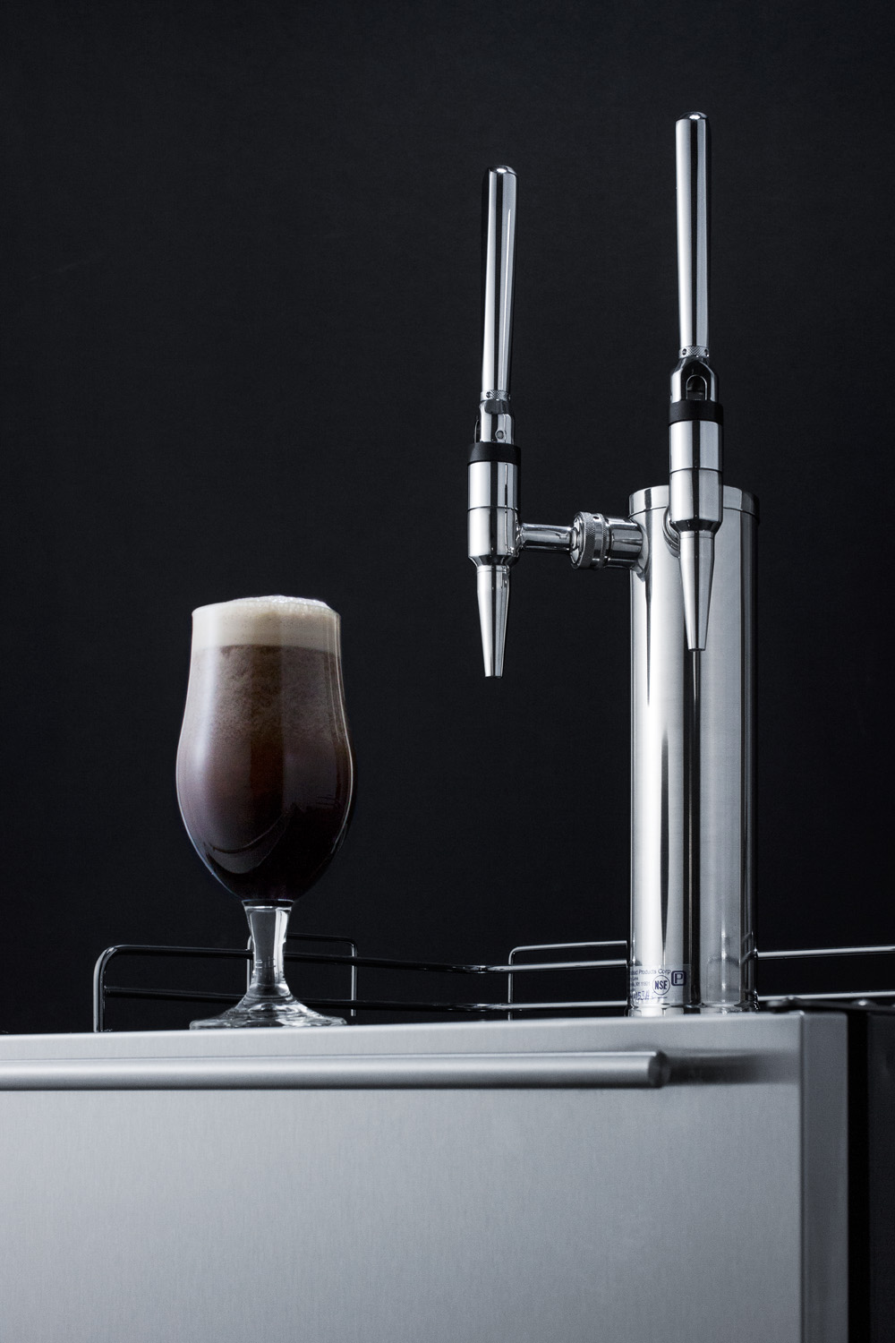 Built-in undercounter ADA height commercially listed dual tap nitro coffee dispenser with stainless steel wrapped door and black cabinet